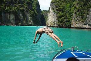 A man is diving into the sea